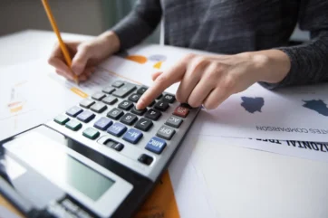 close-up-female-hand-counting-with-calculator-1.webp