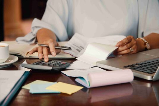 entrepreneur-working-with-bills-1-scaled.jpg